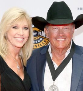 George Strait with wife