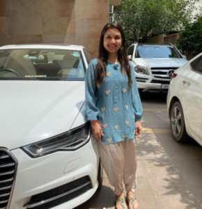 Ashneer Grover's wife posing with their cars