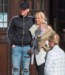 Jordan Pickford with his wife and child