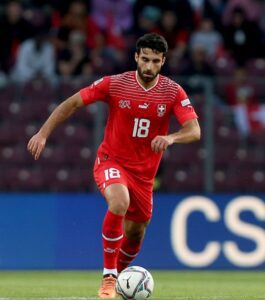 Eray Comert taking a freekick for Switzerland