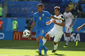 Celso Borges disputing a ball against Brazil's Gabriel Jesus