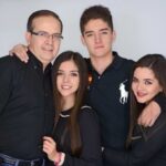 Carlos Acevedo With His Father And Sisters